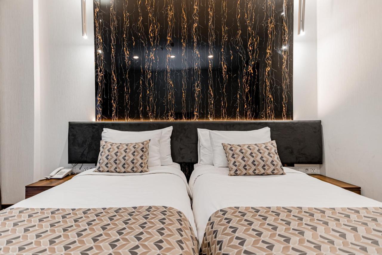 Kutaisi Inn Εξωτερικό φωτογραφία A room at the hotel