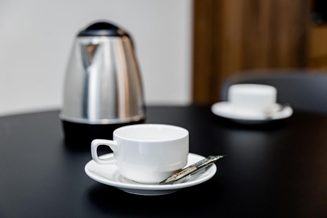 Kutaisi Inn Εξωτερικό φωτογραφία A coffee cup and saucer